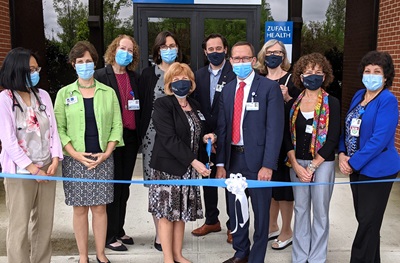 Representatives of Zufall Health and Princeton Health cut the ribbon on Zufall Health Center – Plainsboro.